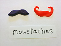 Moustaches made of playdough