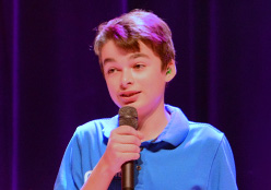 Oliver Baker talking on stage during We Day