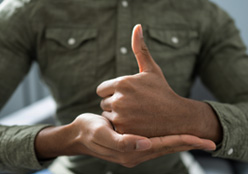 Man Using Sign Language To Communicate