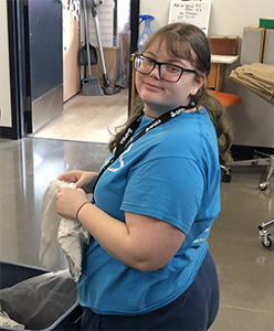 Student sorting clothing